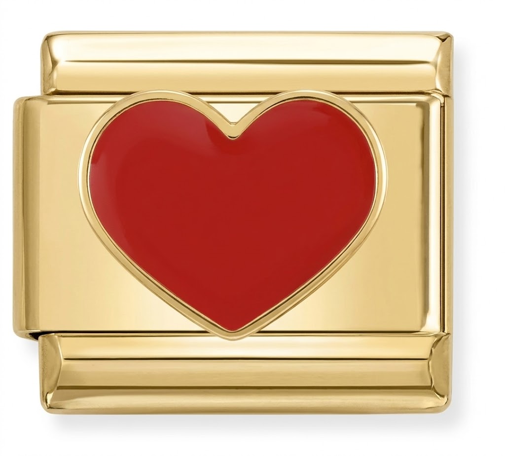 Gold charm with a red heart on a white background