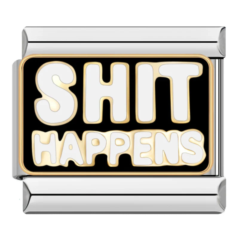 silver charm with 'SHIT HAPPENS' text on a black background