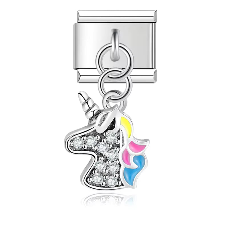 Silver charm with a unicorn design on a white background