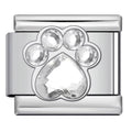 Silver charm with a clear teardrop-shaped gemstone on a white background