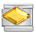 Silver charm with a yellow gemstone on a white background